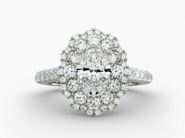 Oval shape diamond, in a flower design encircled 2 halos with channel set diamond on the shanks Engagement Ring