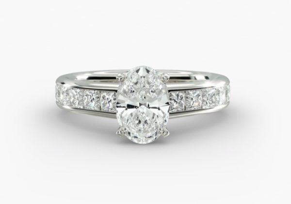 3 carat Oval shape diamond, with prong set smaller diamonds Engagement Ring