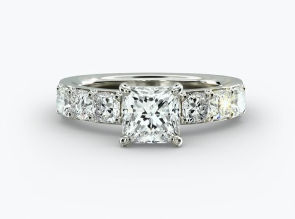 Princess diamond, with smaller channel set diamonds Engagement Ring
